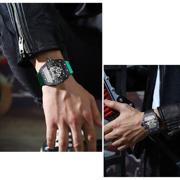 Green silicone sports quartz watch worn on wrist, black skeleton dial with metal accents