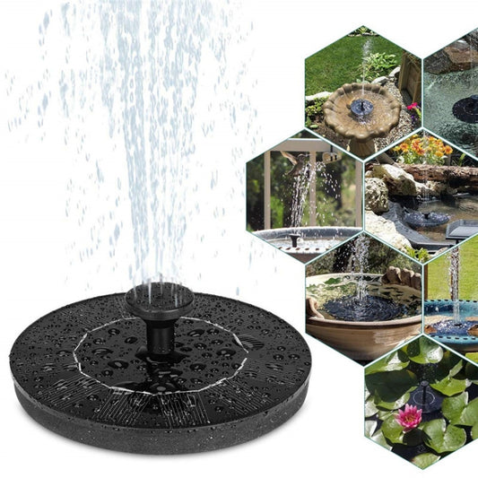 Black floating solar fountain disc with central nozzle spraying water in outdoor water feature