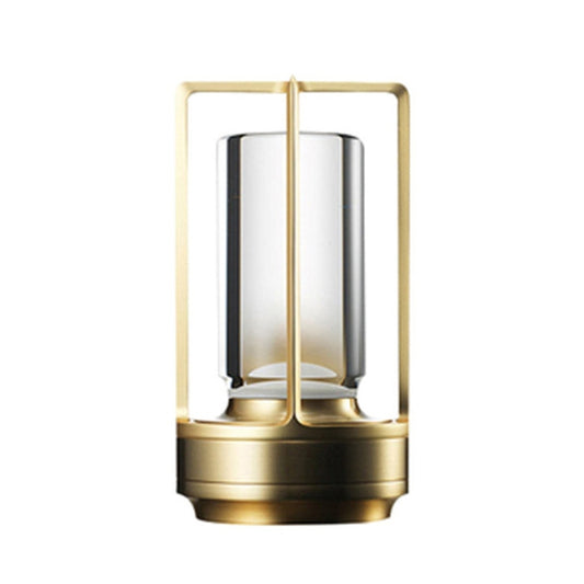 Bronze cross-frame portable table lamp with clear acrylic light pillar and round base