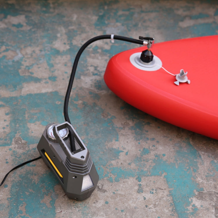 Inflatable paddle board air valve adapter on red board with pump hose attached