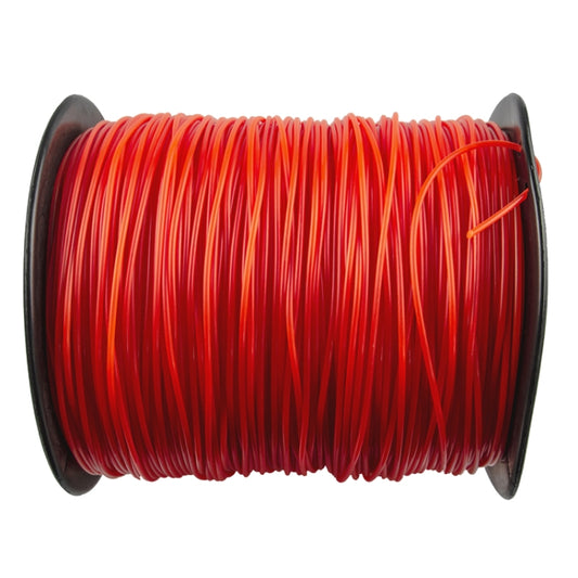 Red orange nylon trimmer line wound on a spool, close-up.