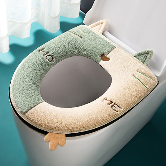 Green and cream fuzzy toilet seat cover with cat ears and round bowl cutout