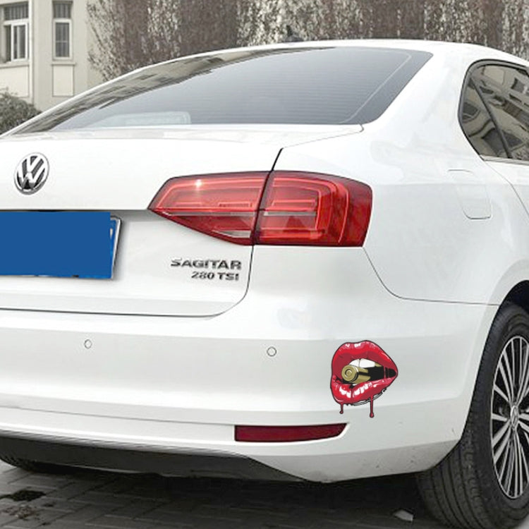 Red lip sticker with gold bullet on car rear bumper
