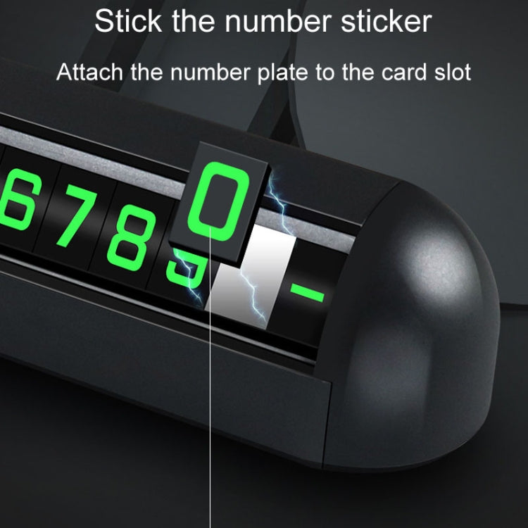 Black number display card slot with a green digit sticker being attached