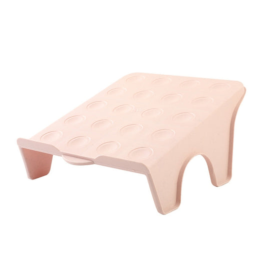 Pink plastic double shoe storage rack with textured top tray and side finger grips