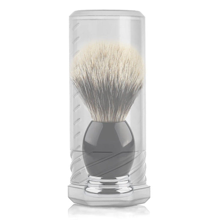 Transparent storage tube holding a beard brush, bristles inside and dark handle