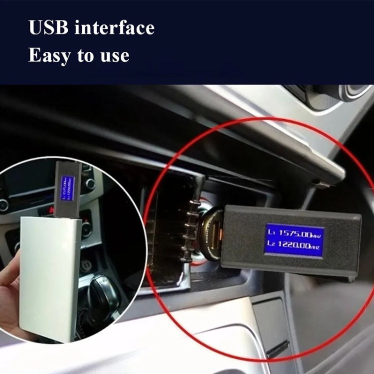 USB GPS jammer inserted into a car console USB slot, LCD screen visible