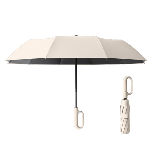 Beige foldable umbrella with black underside and loop handle on the shaft
