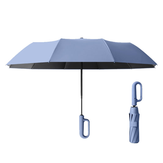 Blue foldable umbrella with black underside and loop handle on the shaft