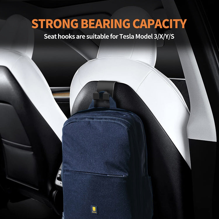 Tesla Model 3/Y rear seat headrest hooks supporting a hanging backpack on rear seats.