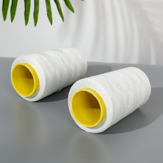 White sewing thread cones with yellow inner cores