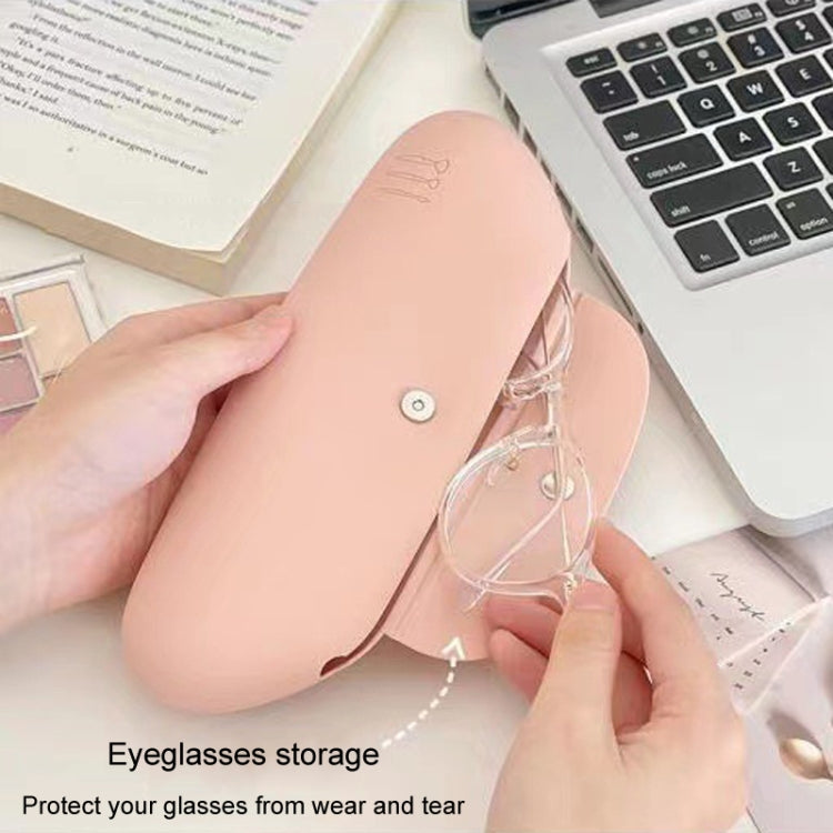 Pink silicone makeup brush and glasses storage bag with button closure, portable travel organizer.