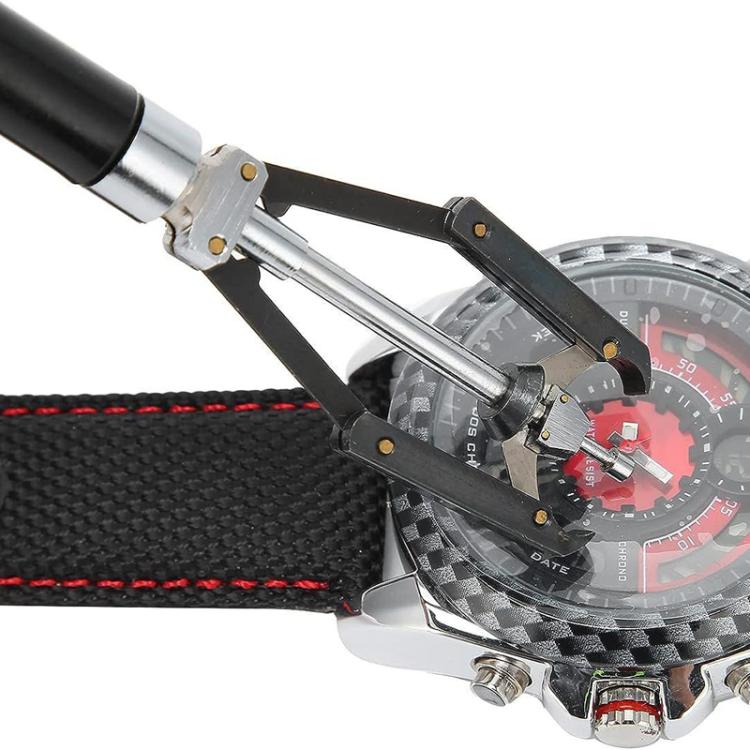 Watch needle remover tool on a watch, lifting the dial needle