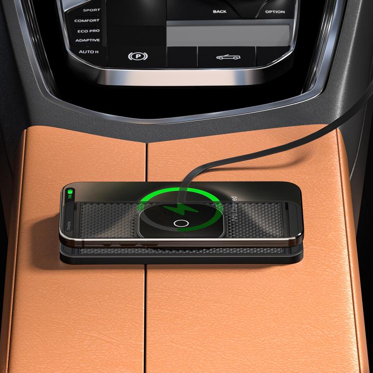 Black magnetic wireless charging pad installed in car center console with green ring
