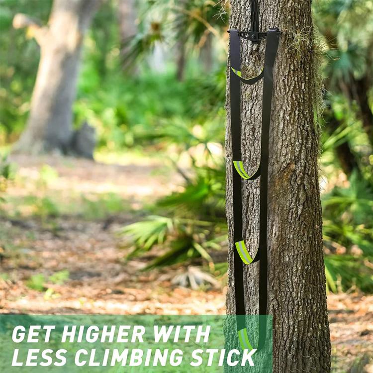 Outdoor black rope climbing ladder wrapped around a tree with neon green loop rungs