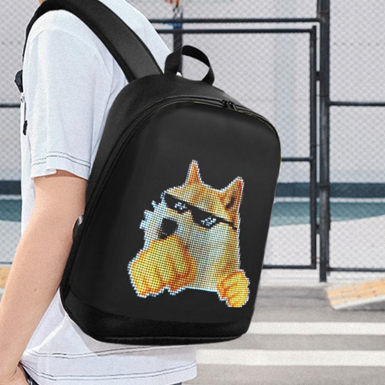 Black mini backpack with pixel cat graphic worn on a person’s back