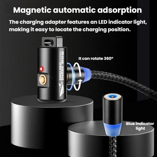 Smiling Shark mini keychain flashlight on magnetic charging base, indicator lights shown