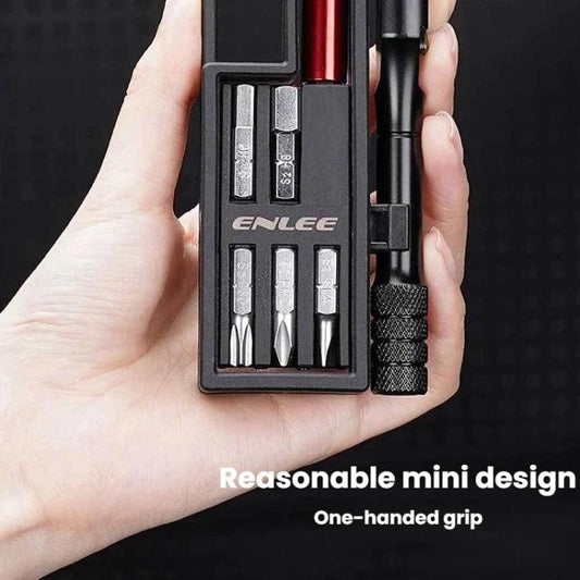 Mini ratchet wrench set with visible bits in black compact case, held in hand