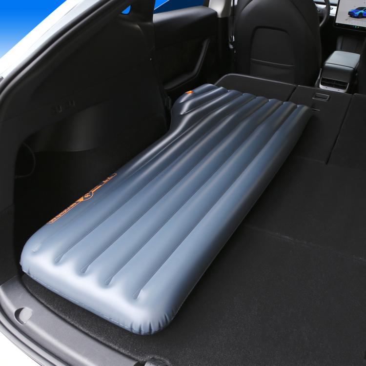 Blue inflatable car bed ramp mat laid flat in a vehicle rear cargo area