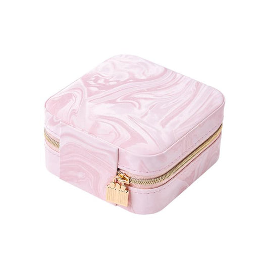 Pink travel jewelry organizer pouch with water-ripple velvet texture and gold zipper.