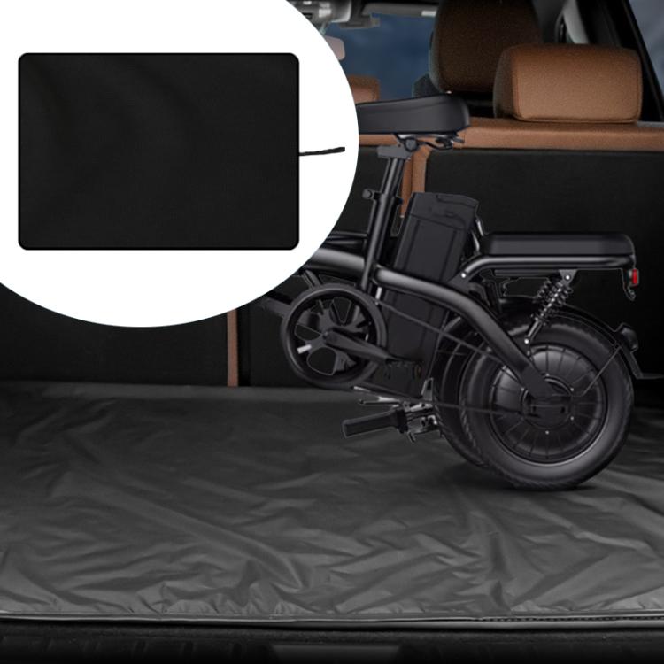 Black waterproof trunk mat laid in car trunk with fold-flat surface
