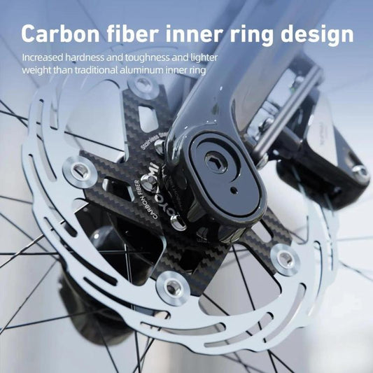 Carbon fiber center-lock disc brake rotor with silver mounting hardware, hub-side close-up