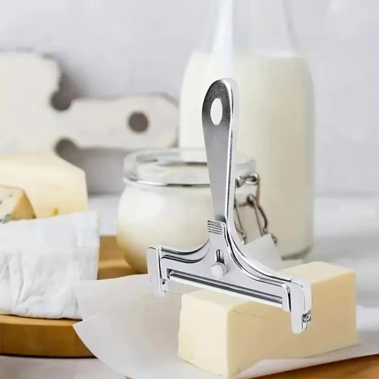 Adjustable thickness cheese slicer with silver metal frame and scraper handle