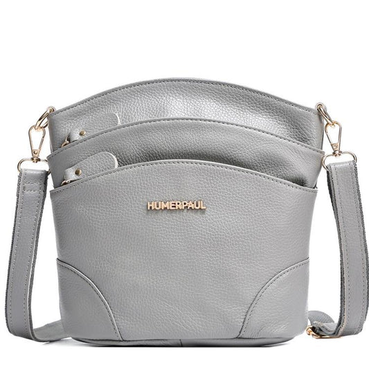 Gray leather shoulder crossbody bag with flap closure and crossbody shoulder strap