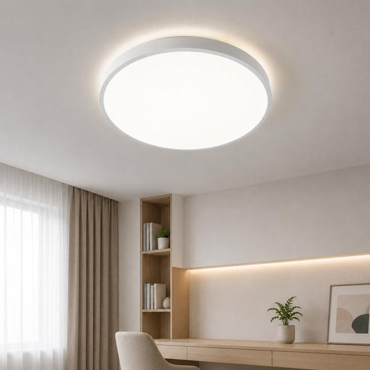 Round LED flush mount ceiling light, white slim rim, illuminated in ceiling.
