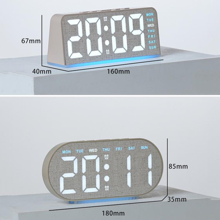 Digital alarm clock with textured grey case, large LED time/date digits and blue glow