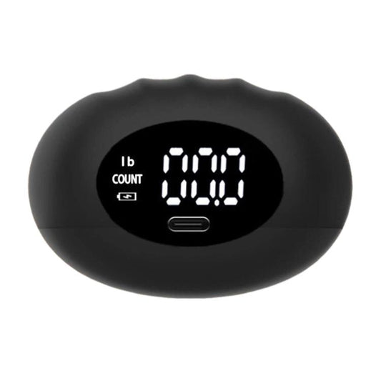 Black digital hand dynamometer with LCD screen showing lb count and charging port