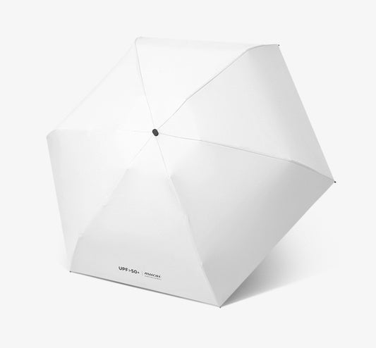 White mini folding umbrella with button center and curved canopy panels.