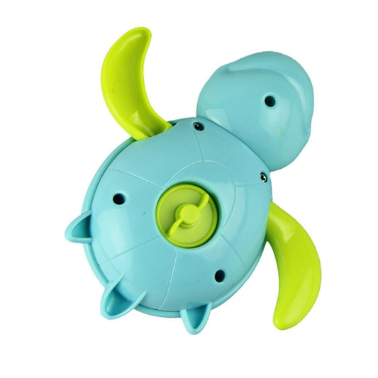 Light blue turtle-shaped bath toy with green shell wheel detail