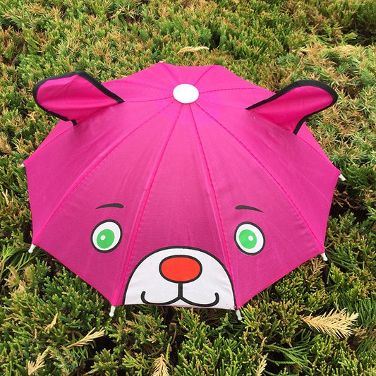 Pink kids animal umbrella with dog face graphic and wide open canopy