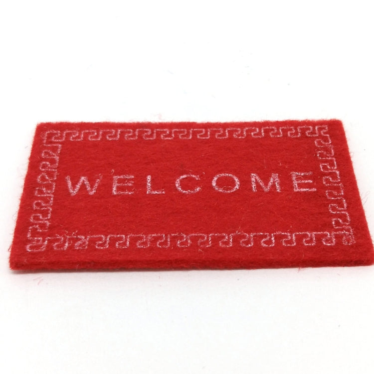 Red dollhouse welcome floor mat with 'WELCOME' lettering and decorative edge