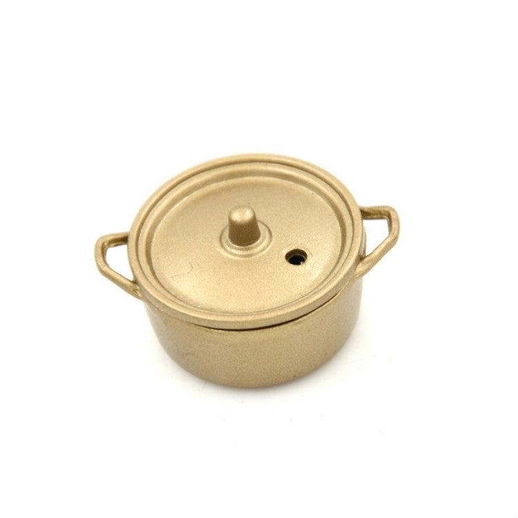 Miniature gold alloy cooking pot with lid, side handles, and central lid knob