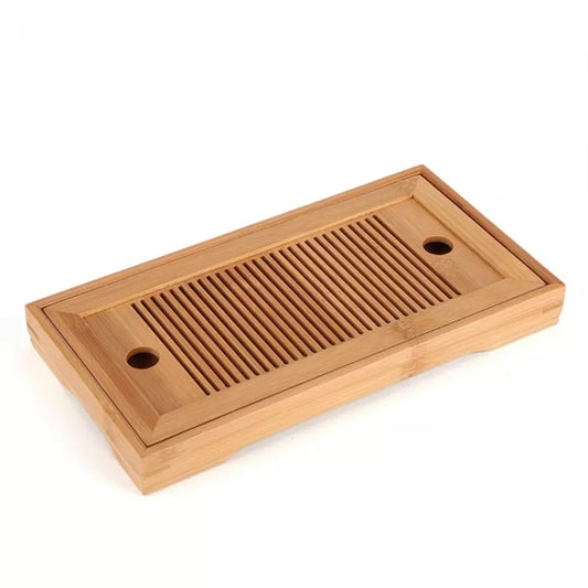 Bamboo tea tray with slatted grate and round holes, angled view