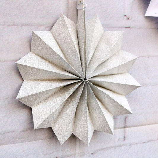Large white glitter paper fan flower rosette with folded pointed petals