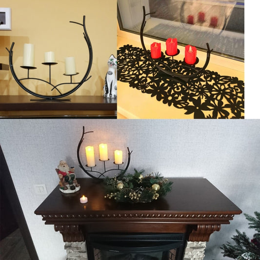 Black metal decorative candle holder in living room, holding lit candles