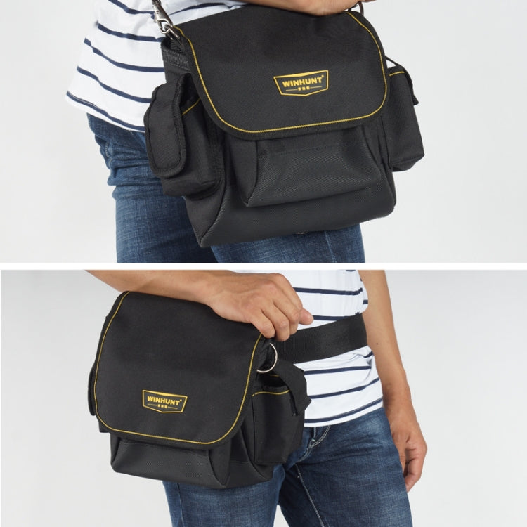 WINHUNT black canvas tool bag worn on hip with crossbody strap and front flap