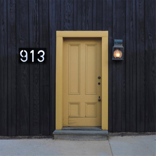 Black solar wall mount house number lamp with backlit digits 913, 6 LEDs