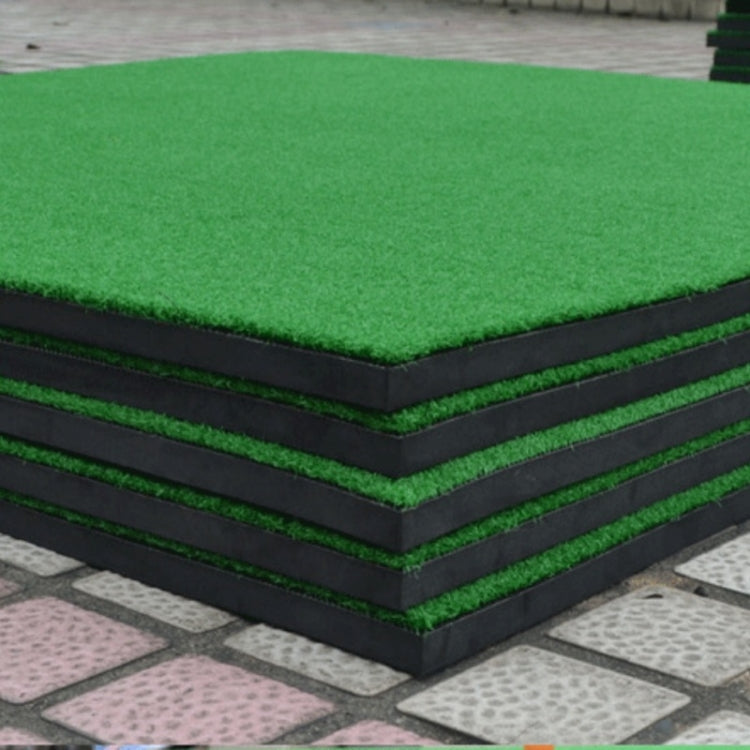 Square golf practice mat with green turf top and dark layered foam sides