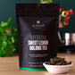 Black tea pouch with Sweet Lemon Oolong Tea front label and small bowl of loose tea leaves