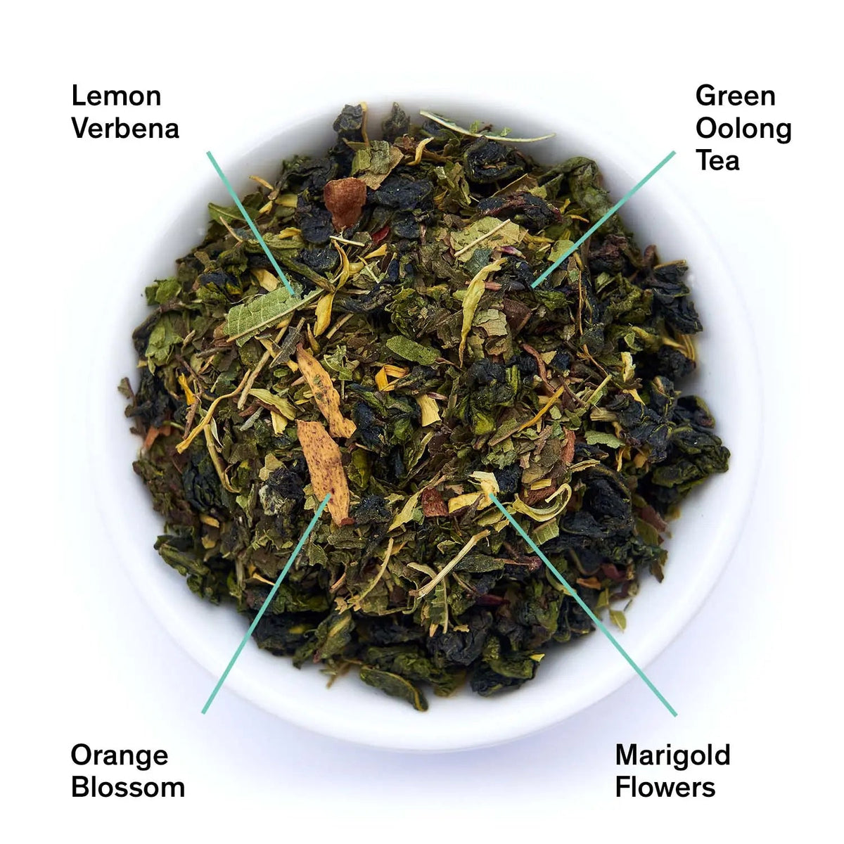 Bowl of loose green oolong tea leaves with lemon verbena, orange blossom, and marigold flowers