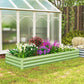Light green galvanized raised garden bed with mixed flowers and green foliage
