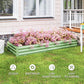 Light green galvanized raised garden bed with pink and white flowers in outdoor yard