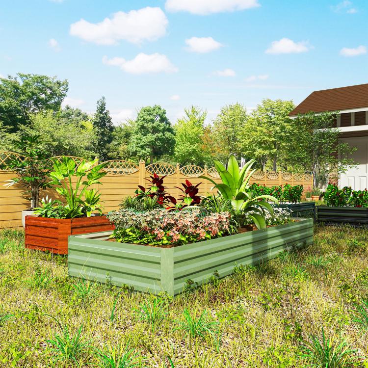 Light green galvanized raised garden bed with mixed plants and flowers