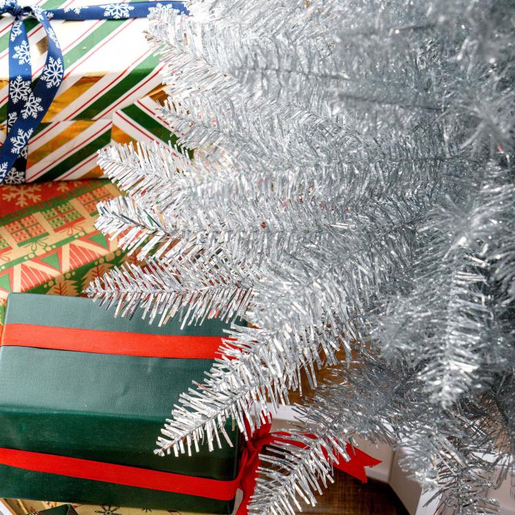 Silver unlit pencil artificial Christmas tree with dense metallic branch tips