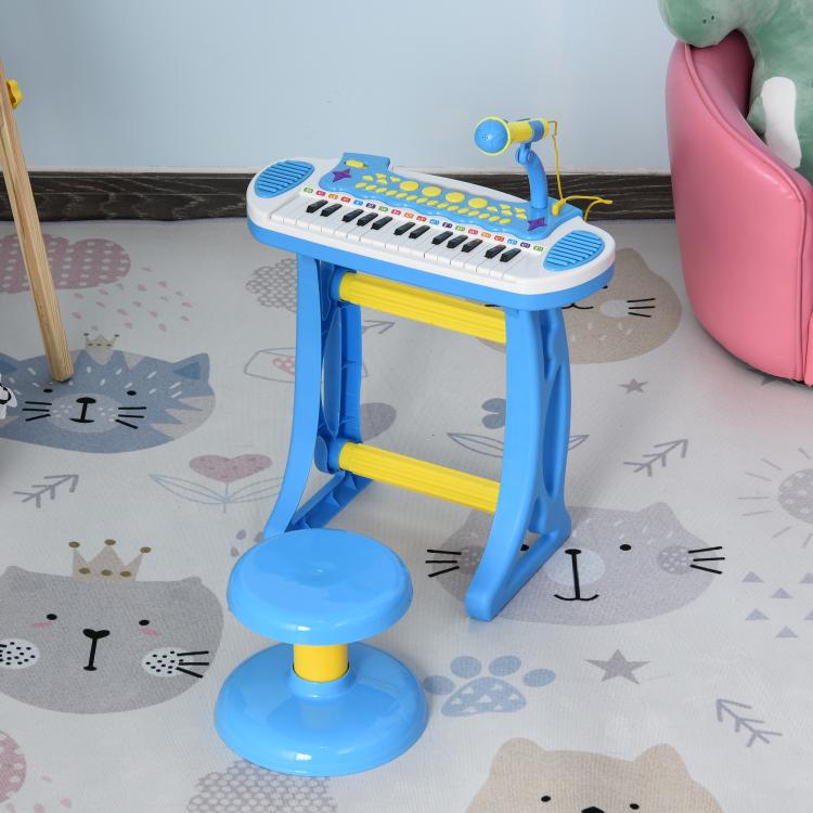 Blue kids electronic toy keyboard with microphone and round stool on play mat
