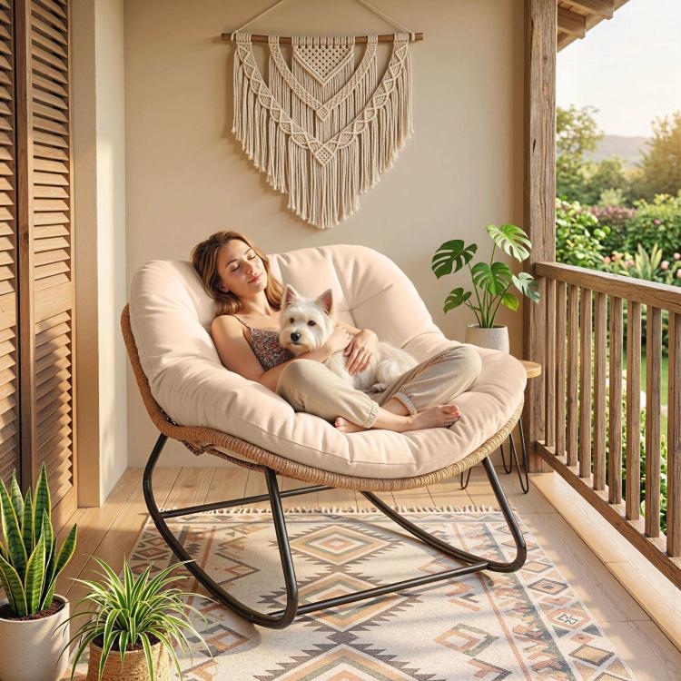 Cream white papasan rocking chair with plush cushion, woven rattan sides, and black base